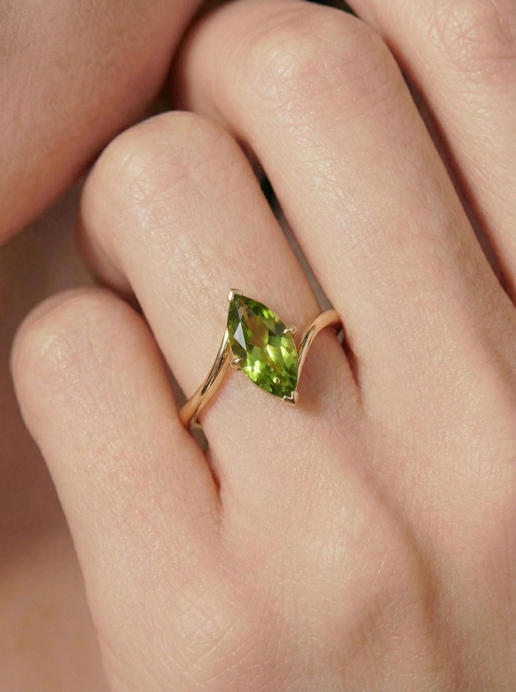 1.5ct Peridot Ring, Marquise Cut Emerald Solitaire, Curved Bypass Band, August Birthstone, 14K Gold Nature Inspired Ring