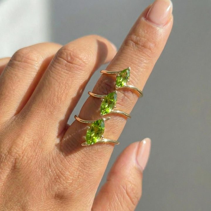 1.5ct Peridot Ring, Marquise Cut Emerald Solitaire, Curved Bypass Band, August Birthstone, 14K Gold Nature Inspired Ring