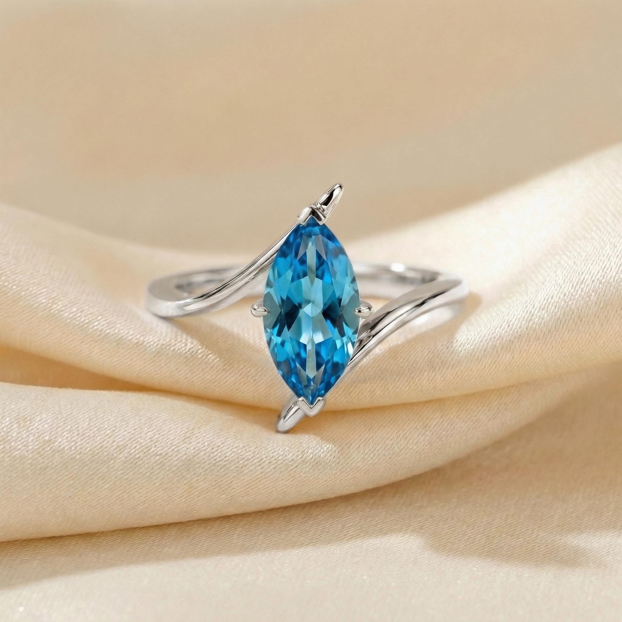 1.5ct Marquise Blue Zircon Ring, December Birthstone Engagement Ring, 14K Gold Curved Bypass Nature Inspired Ring