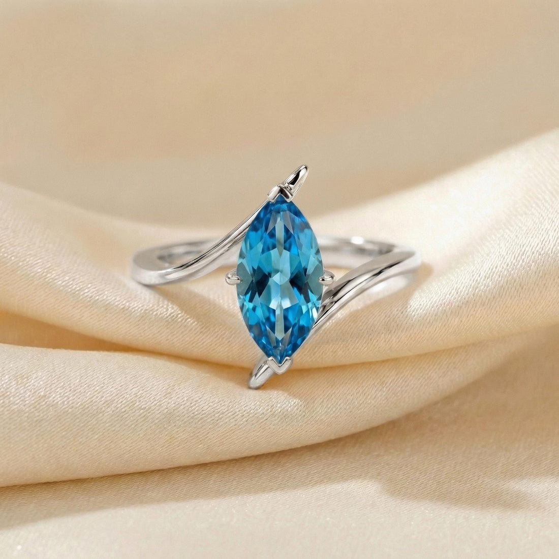 1.5ct Marquise Blue Zircon Ring, December Birthstone Engagement Ring, 14K Gold Curved Bypass Nature Inspired Ring