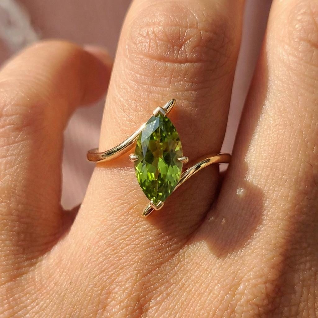 1.5ct Peridot Ring, Marquise Cut Emerald Solitaire, Curved Bypass Band, August Birthstone, 14K Gold Nature Inspired Ring