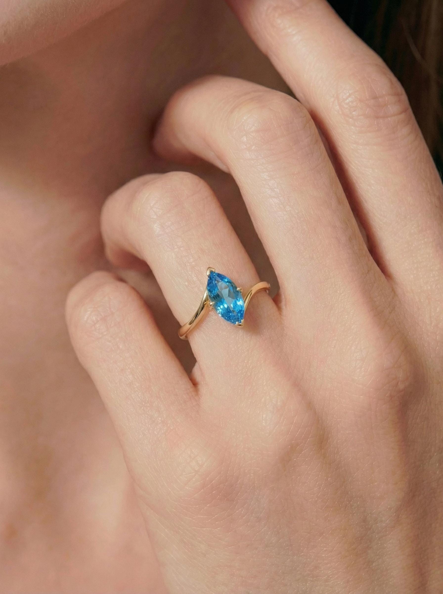 1.5ct Marquise Blue Zircon Ring, December Birthstone Engagement Ring, 14K Gold Curved Bypass Nature Inspired Ring