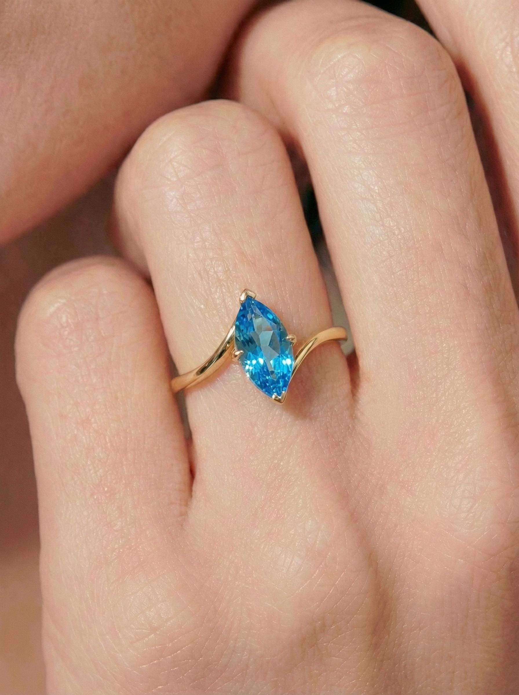 1.5ct Marquise Blue Zircon Ring, December Birthstone Engagement Ring, 14K Gold Curved Bypass Nature Inspired Ring
