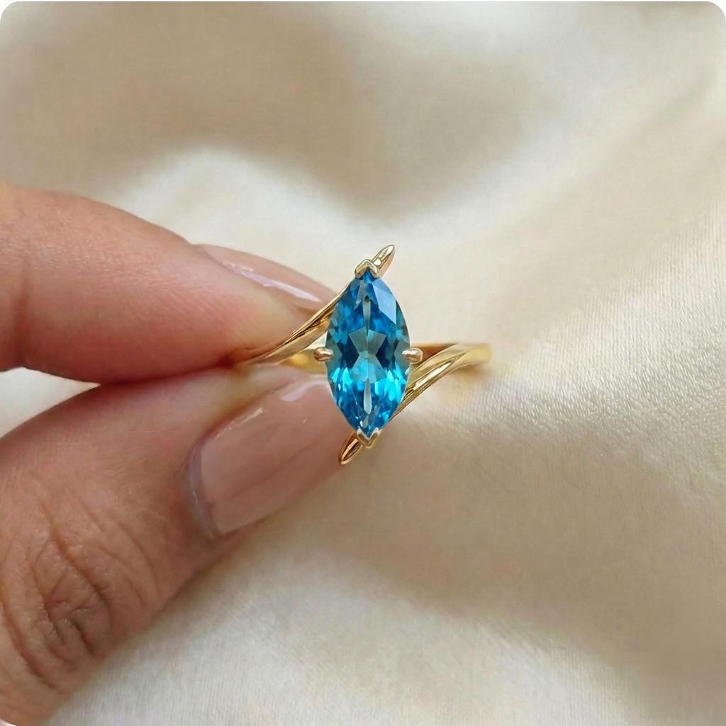 1.5ct Marquise Blue Zircon Ring, December Birthstone Engagement Ring, 14K Gold Curved Bypass Nature Inspired Ring