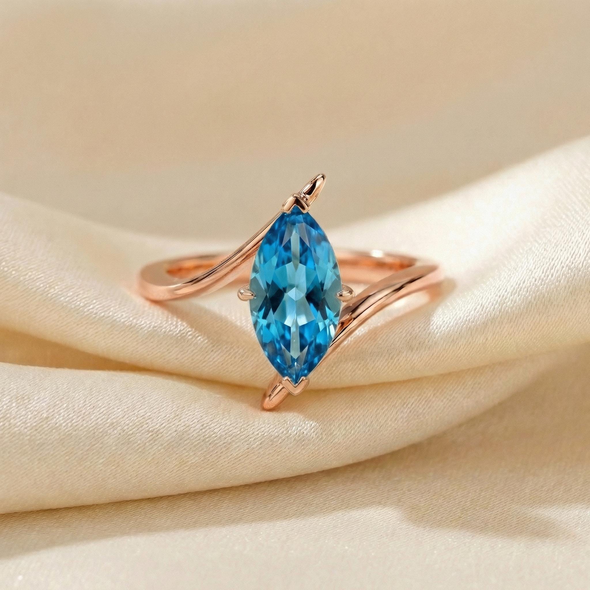 1.5ct Marquise Blue Zircon Ring, December Birthstone Engagement Ring, 14K Gold Curved Bypass Nature Inspired Ring
