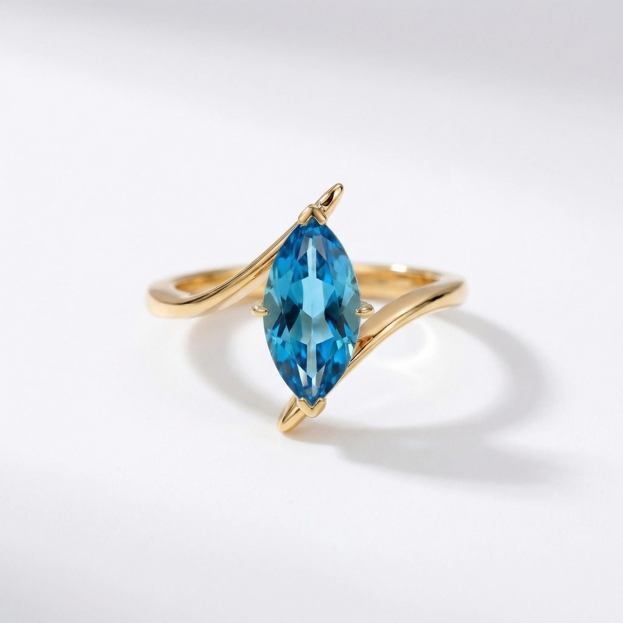 1.5ct Marquise Blue Zircon Ring, December Birthstone Engagement Ring, 14K Gold Curved Bypass Nature Inspired Ring
